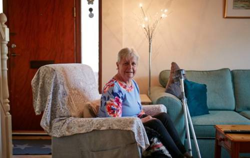 Brenda in her living room