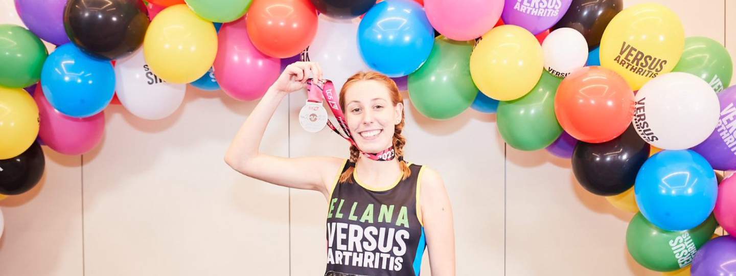 Ellana holding her medal at the London Marathon