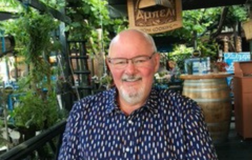 Smiling Malcolm in restaurant