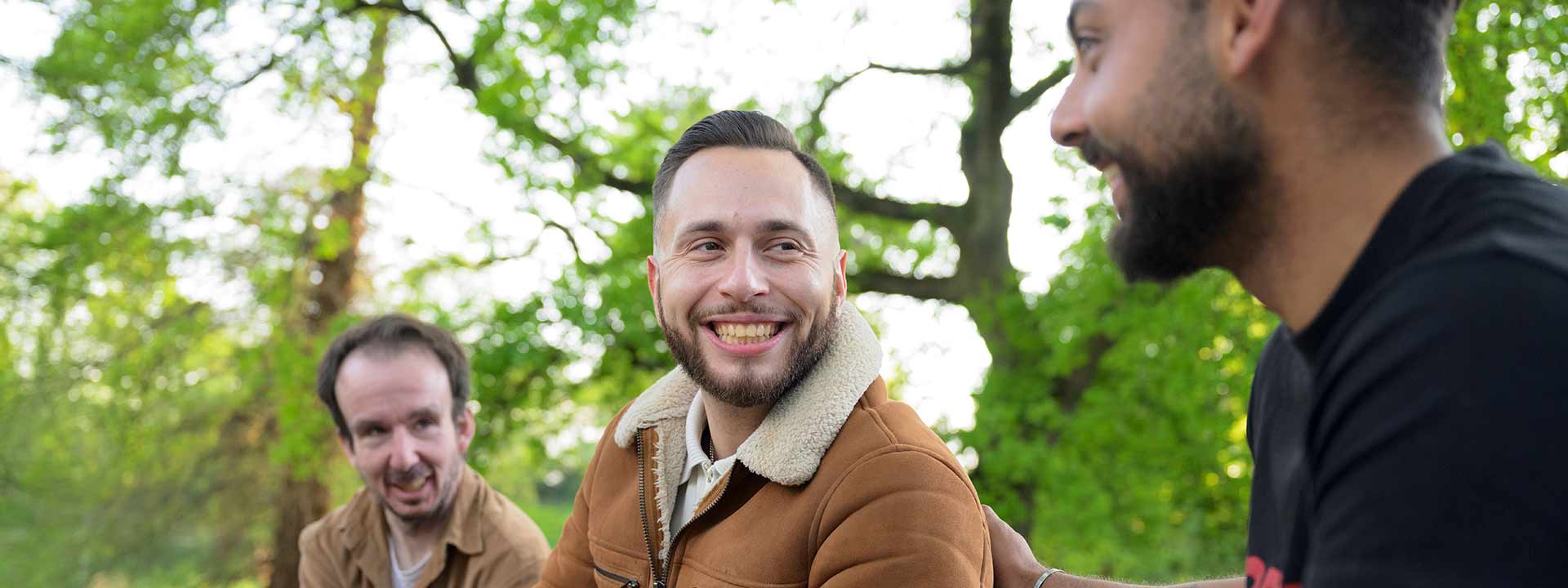James and friends talking in the woods