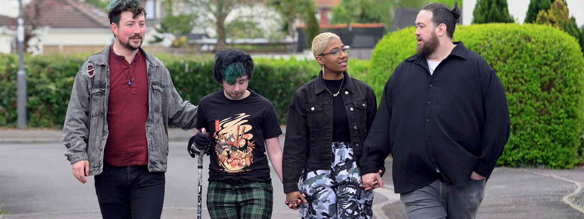 A group with Arthritis walking down a road