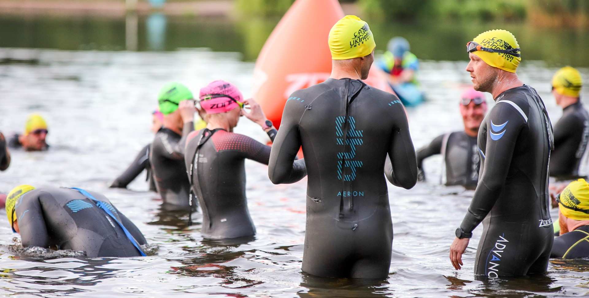 Triathlon challengers preparing to swim