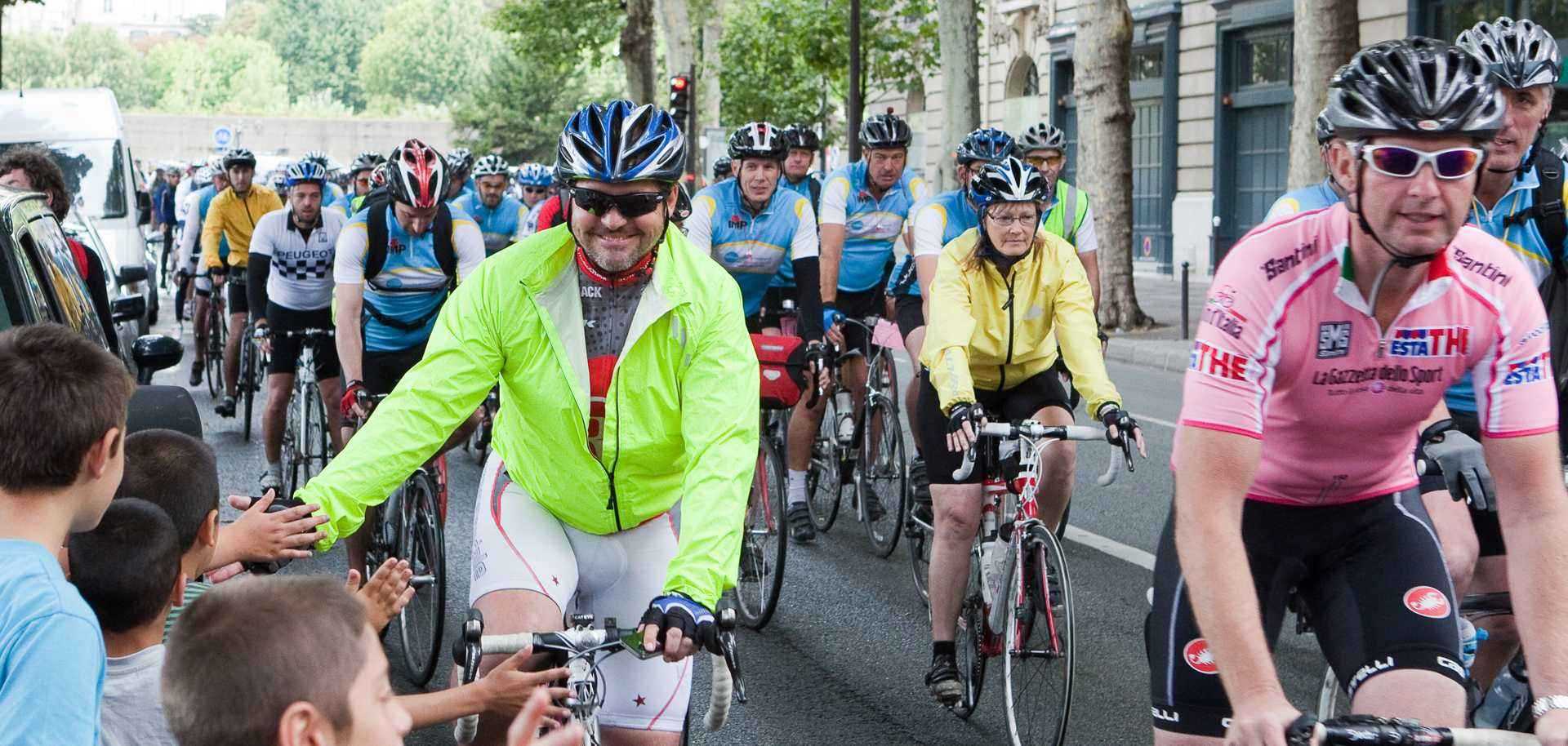 Cyclists racing down a city street