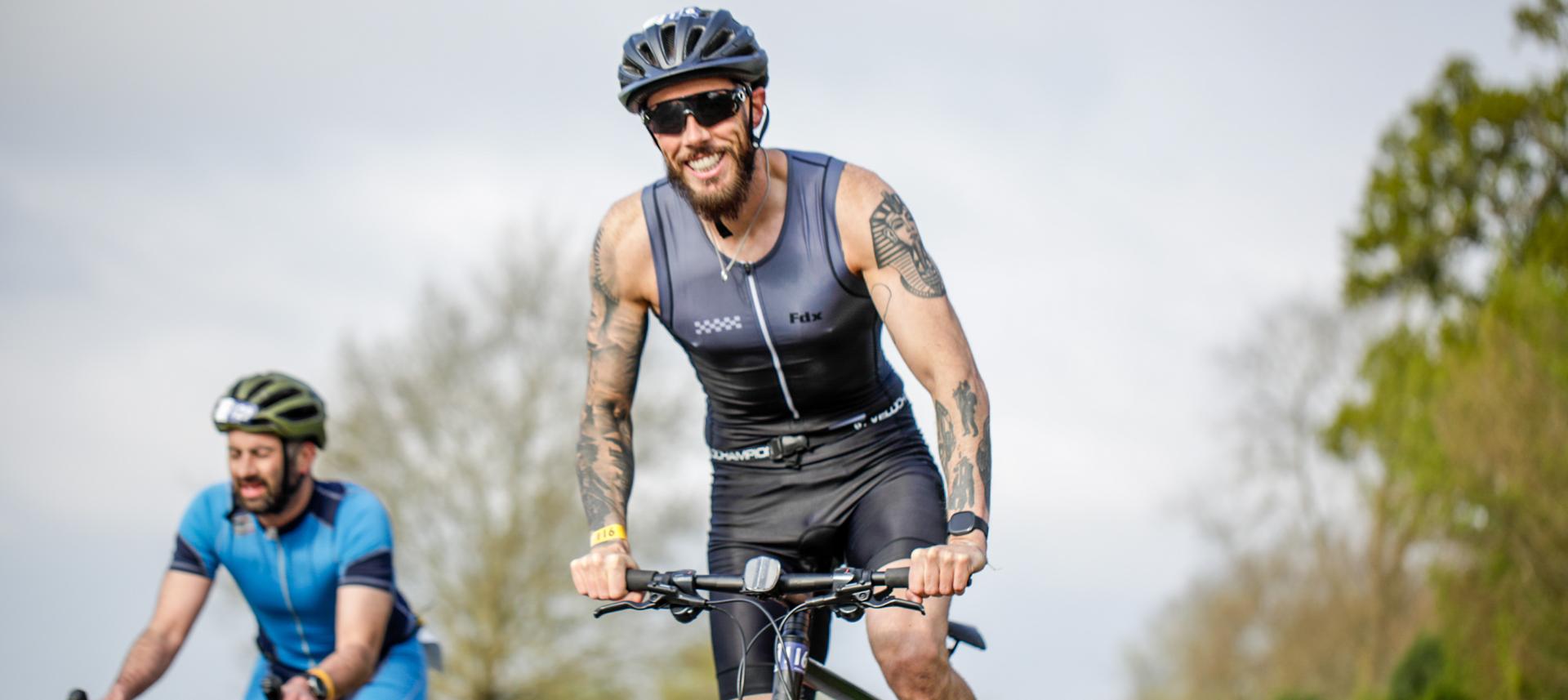 Triathlon challengers racing on bikes